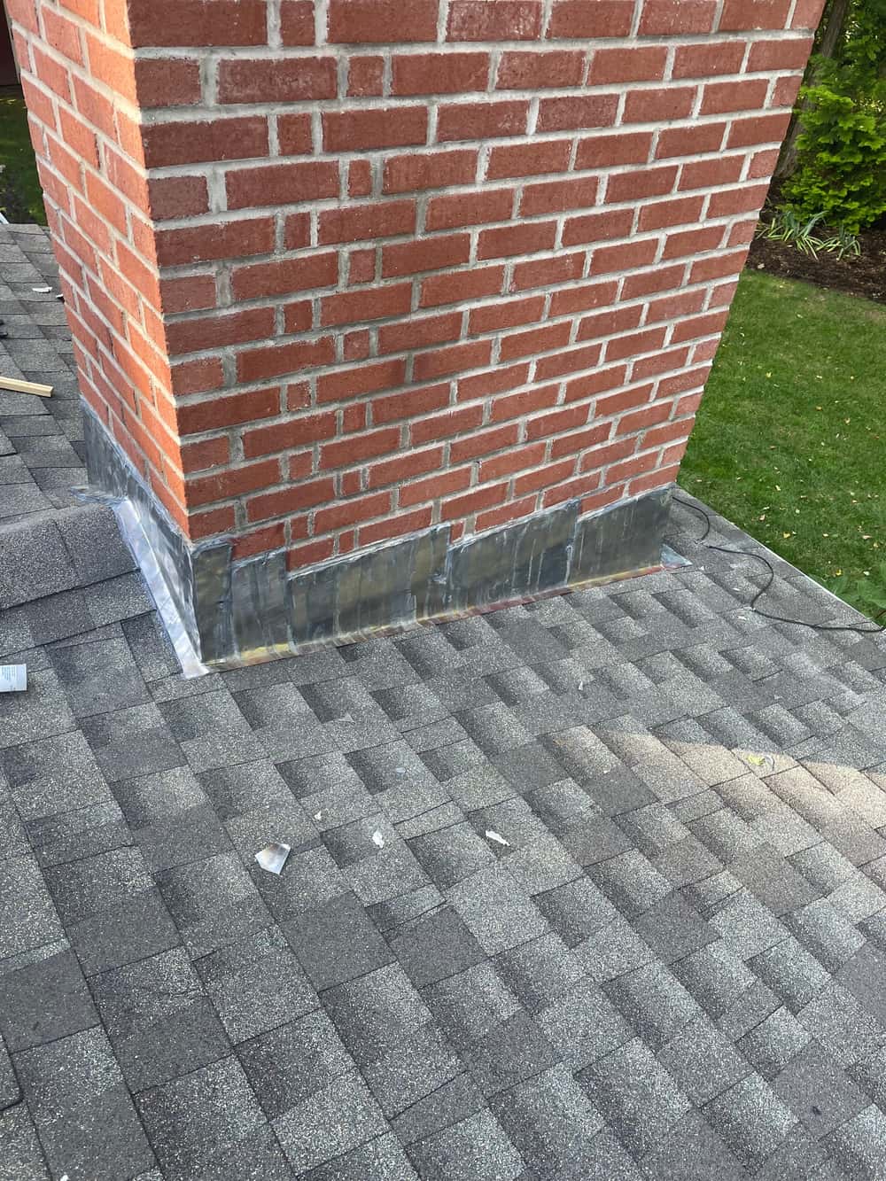 New step flashing and counter flashing properly installed around a Connecticut chimney