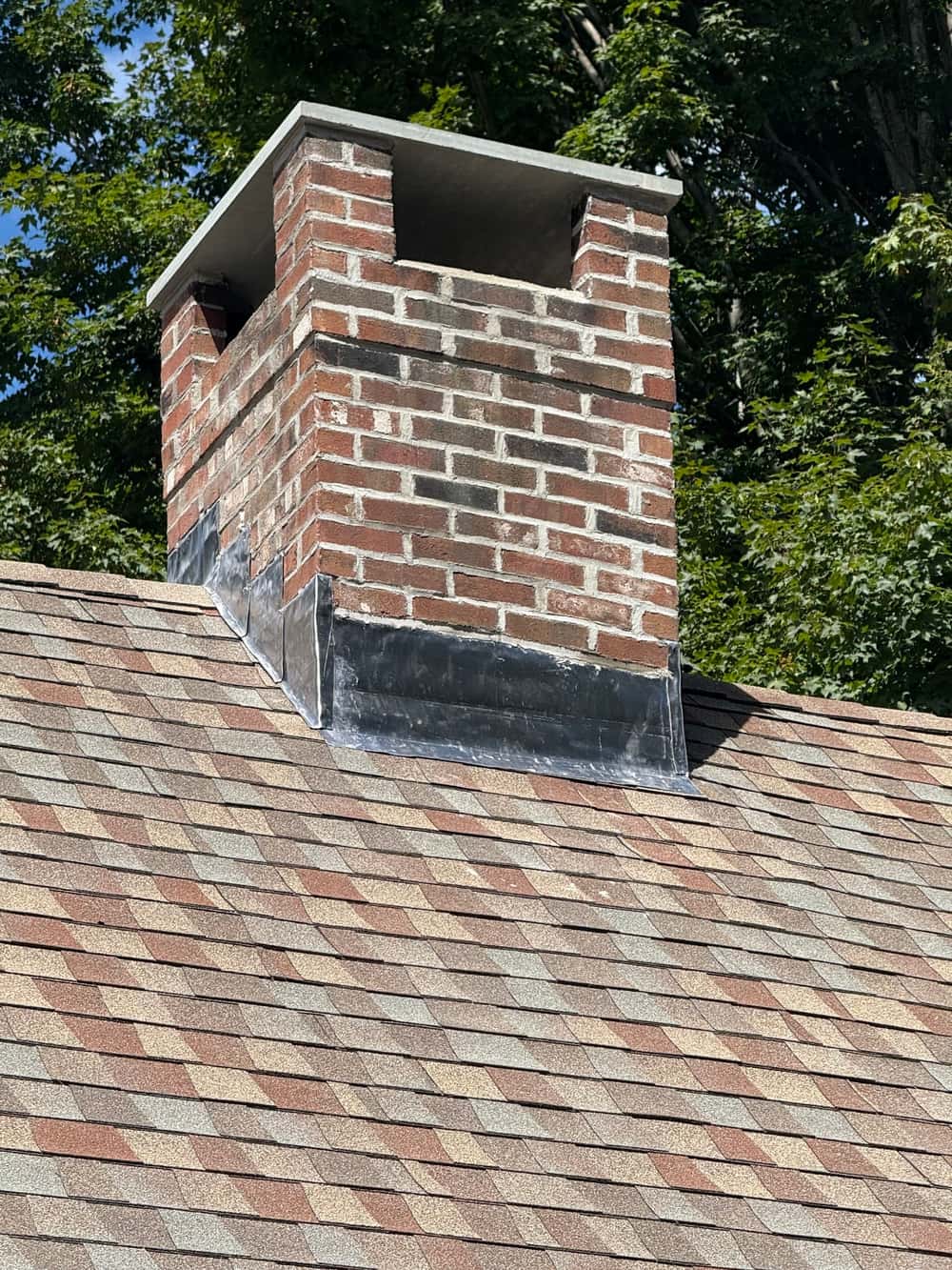 New cement crown and stainless steel cap on a restored Connecticut chimney